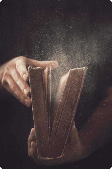 holding-an-open-book-with-dust-coming-out